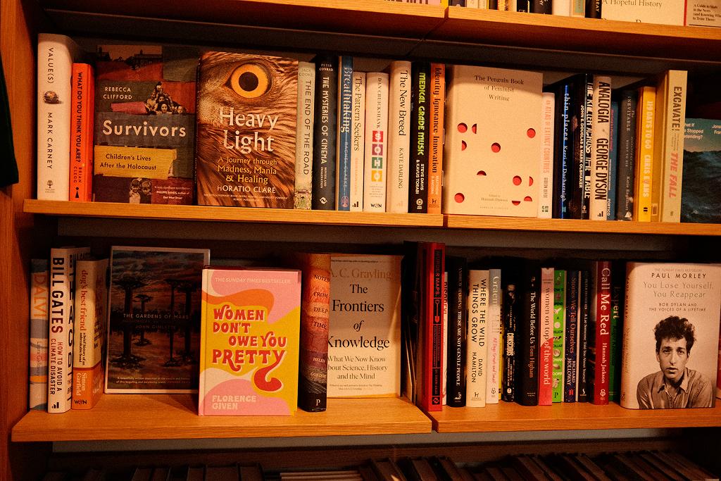 Shelves of colourful books in a bookshop