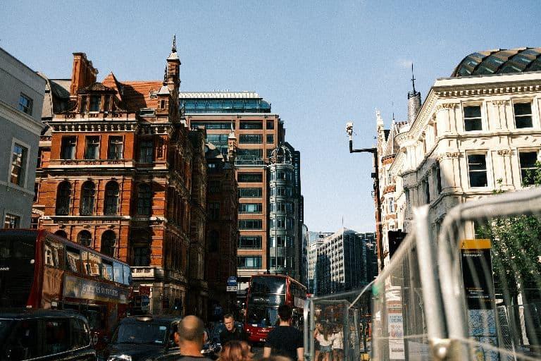 Red brick Victorian buildings on a busy city street